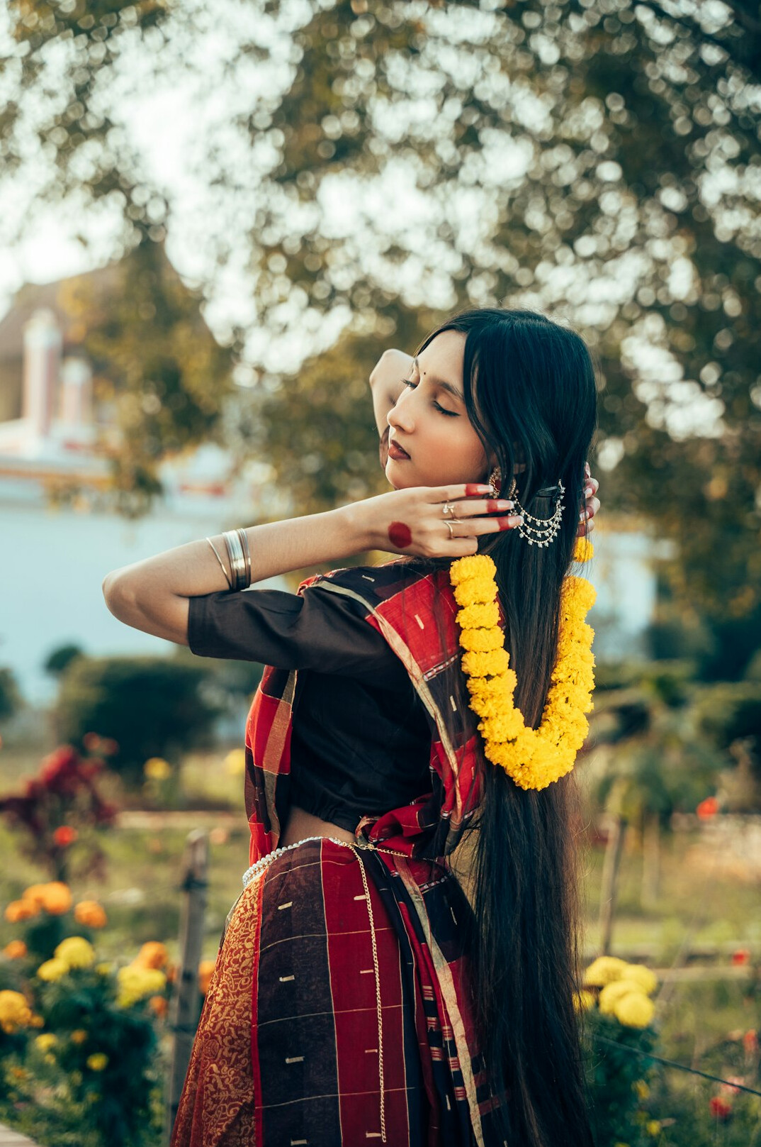 Portrait of a South Asian woman with long dark hair smiling