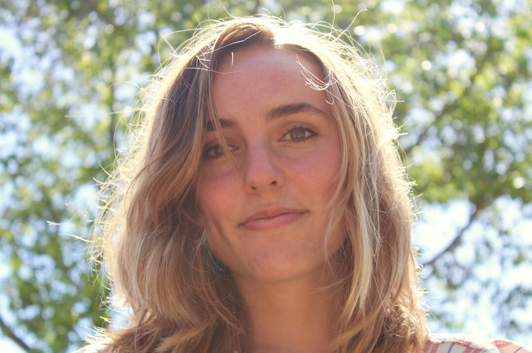 Portrait of a woman with blonde hair smiling